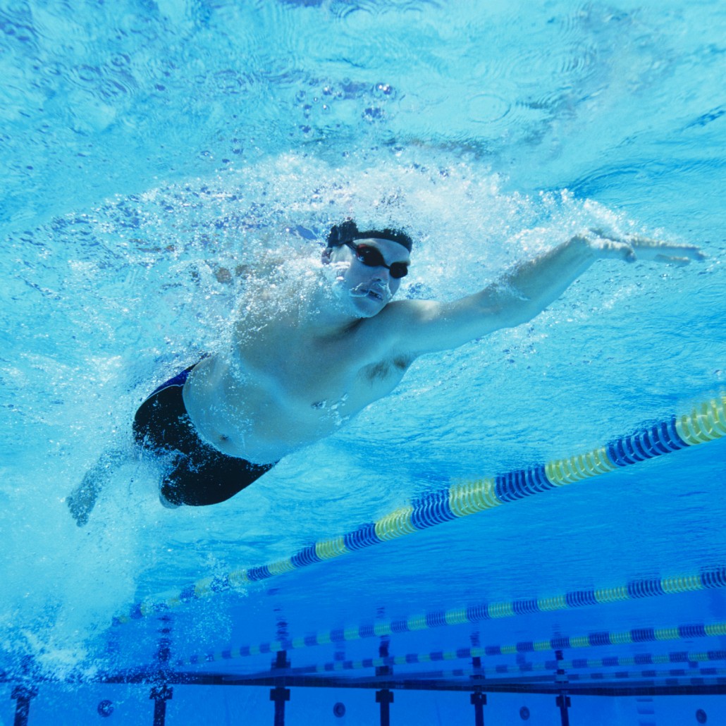 Man Swimming in Pool